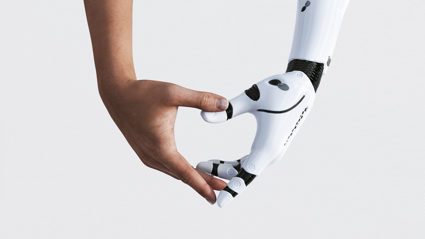Mains robotique et humaine qui se rejoignent, symbole d’accompagnement et technologie